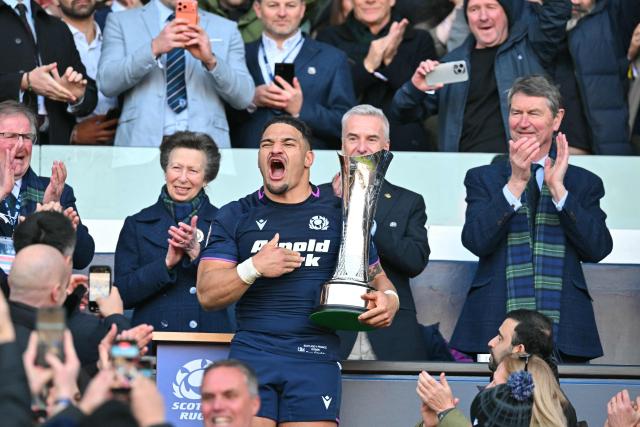 Scotland's centre Sione Tuipulotu lifts the Auld Alliance trophy after the Six Nations international rugby union match between Scotland and France at Murrayfield Stadium in Edinburgh, Scotland on March 7, 2026. Scotland won the game 50 - 40. (Photo by ANDY BUCHANAN / AFP)