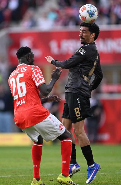 Stuttgart's Portuguese forward #08 Tiago Tomas (R) and Mainz' Congolese forward #26 Silas Katompa Mvumpa vie for the ball during the German first division Bundesliga football match between 1 FSV Mainz 05 and VfB Stuttgart in Mainz, western Germany on March 7, 2026. (Photo by Kirill KUDRYAVTSEV / AFP) / DFL REGULATIONS PROHIBIT ANY USE OF PHOTOGRAPHS AS IMAGE SEQUENCES AND/OR QUASI-VIDEO