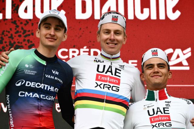 (From L) Second placed UCI WorldTeam Decathlon CMA CGM's French Paul Seixas, first placed UAE Team Emirates's Slovenian Tadej Pogacar and third placed Del UAE Team Emirates XRG's MexicanIsaac Del Toro Romero celebrate on the podium after competing in the 20th one-day classic 'Strade Bianche' (White Roads) men's cycling race between Siena and Siena in Tuscany on March 7, 2026. (Photo by Marco BERTORELLO / AFP)