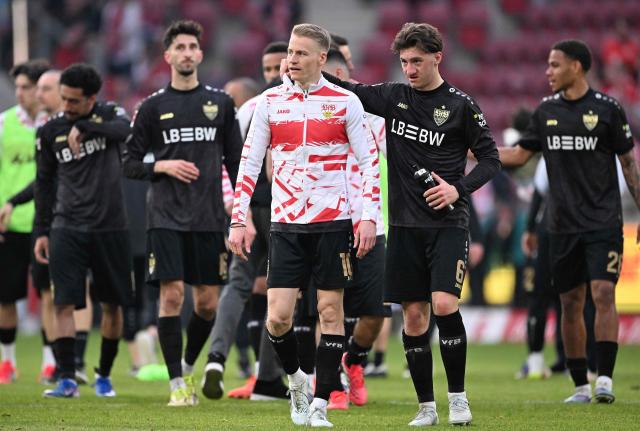 Stuttgart's players including German midfielder #06 Angelo Stiller (2nd R) and Stuttgart's German midfielder #10 Chris Fuehrich react after the German first division Bundesliga football match between 1 FSV Mainz 05 and VfB Stuttgart in Mainz, western Germany on March 7, 2026. (Photo by Kirill KUDRYAVTSEV / AFP) / DFL REGULATIONS PROHIBIT ANY USE OF PHOTOGRAPHS AS IMAGE SEQUENCES AND/OR QUASI-VIDEO
