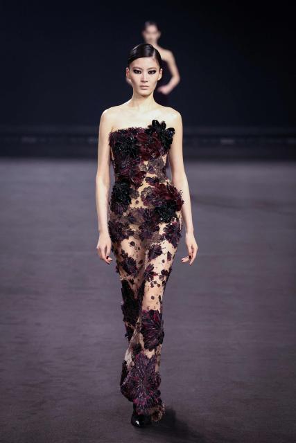 A model presents a creation by Elie Saab for the Women's Ready to Wear Fall/Winter 2026-2027 collection fashion show as part of the Paris Women Fashion Week, in Paris, on March 7, 2026. (Photo by Alain JOCARD / AFP)