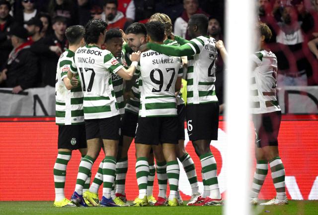 Sporting Lisbon's Portuguese defender #25 Goncalo Inacio (C) celebrates scoring his team's first goal with teammates during the Portuguese league football match between SC Braga and Sporting CP at Municipal Stadium in Braga on March 7, 2026. (Photo by Miguel RIOPA / AFP)