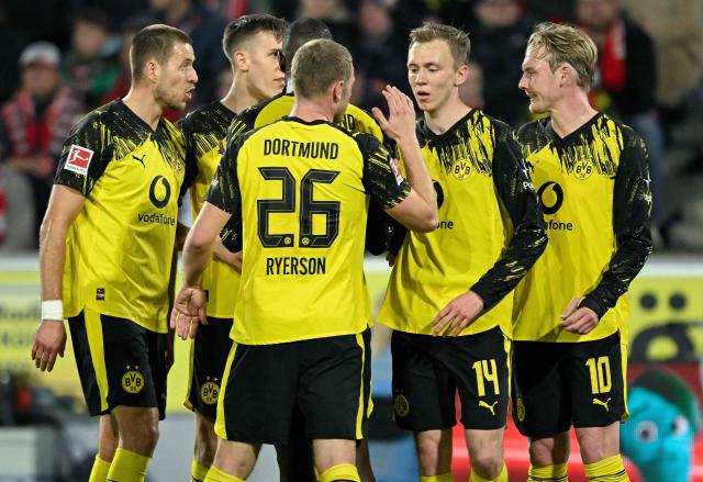 Dortmund's German forward #14 Maximilian Beier (2nd R) celebrates scoringthe 0-2 goal with his teammates during the German first division Bundesliga football match 1 FC Cologne v BVB Borussia Dortmund in Cologne, western Germany, on March 7, 2026. (Photo by INA FASSBENDER / AFP) / DFL REGULATIONS PROHIBIT ANY USE OF PHOTOGRAPHS AS IMAGE SEQUENCES AND/OR QUASI-VIDEO
