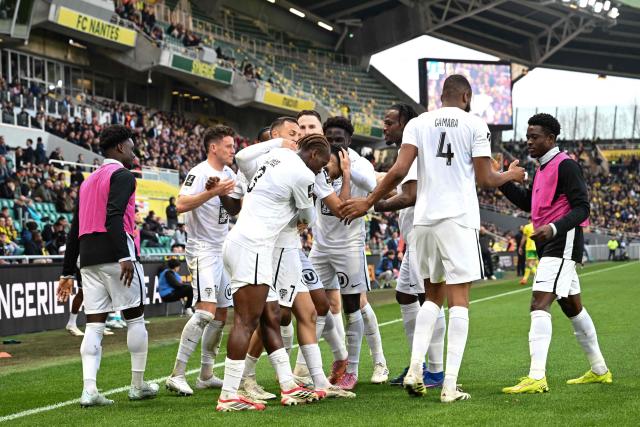 Angers' players celebrate after scoring a goal during the French L1 football match between FC Nantes and SCO Angers at the Stade de la Beaujoire–Louis-Fonteneau in Nantes, western France, on March 7, 2026. (Photo by Sebastien Salom-Gomis / AFP)