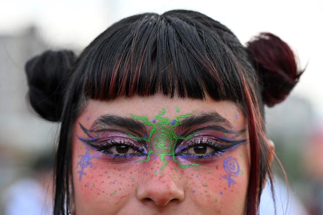 A demonstrator poses for a picture during a rally on the eve of International Women's Day in Bogota on March 7, 2026. (Photo by Diana SANCHEZ / AFP)