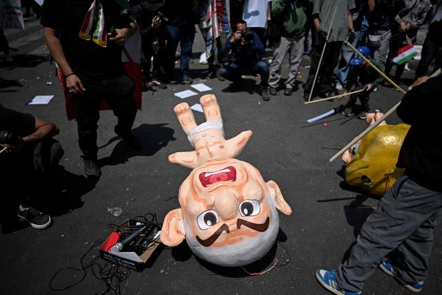 Protestors hit a pinata depicting Israel's Prime Minister Benjamin Netanyahu outside the US consulate during a protest against the conflict in the Middle East in Mexico City on March 7, 2026. (Photo by Carl de Souza / AFP)