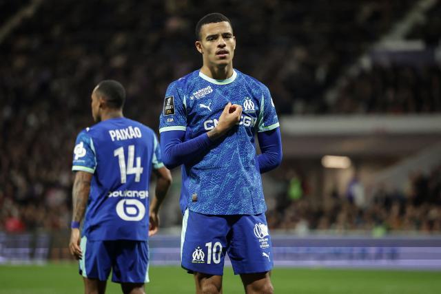 Marseille's English forward #10 Mason Greenwood gestures after scoring his team first goal during the French L1 football match between Toulouse FC and Olympique de Marseille (OM) at the TFC Stadium in Toulouse, southwestern France, on March 7, 2026. (Photo by Valentine CHAPUIS / AFP)