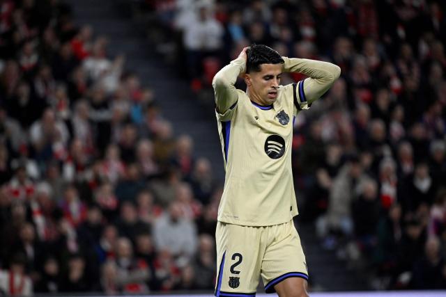 Barcelona's Portuguese defender #02 Joao Cancelo reacts after missing a goal opportunity during the Spanish league football match between Athletic Club Bilbao and FC Barcelona at San Mames Stadium in Bilbao on March 7, 2026. (Photo by ANDER GILLENEA / AFP)