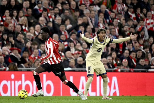 Barcelona's Spanish forward #10 Lamine Yamal reacts next to Athletic Bilbao's Spanish defender #19 Adama Boiro during the Spanish league football match between Athletic Club Bilbao and FC Barcelona at San Mames Stadium in Bilbao on March 7, 2026. (Photo by ANDER GILLENEA / AFP)