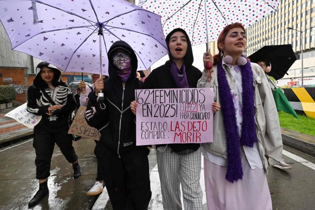 Demonstrators take part in a rally on the eve of International Women's Day in Bogota on March 7, 2026. (Photo by Diana SANCHEZ / AFP)