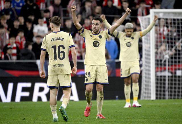 Barcelona's Spanish midfielder #16 Fermin Lopez, Barcelona's Spanish defender #24 Eric Garcia and Barcelona's Uruguayan defender #04 Ronald Federico Araujo da Silva celebrate victory at the end of the Spanish league football match between Athletic Club Bilbao and FC Barcelona at San Mames Stadium in Bilbao on March 7, 2026. Barcelona won 0-1. (Photo by ANDER GILLENEA / AFP)