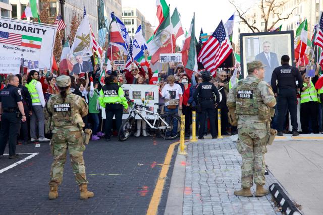 Demonstrators from the Iranian diaspora wave pre-Islamic revolution Iranian, Israeli and US flags as they protest against the Iranian government in front of the White House in Washington, DC, on March 7, 2026. Protesters gathered in the US capital to denounce the Iranian regime and express solidarity with anti-government movements in Iran. (Photo by Amid FARAHI / AFP)