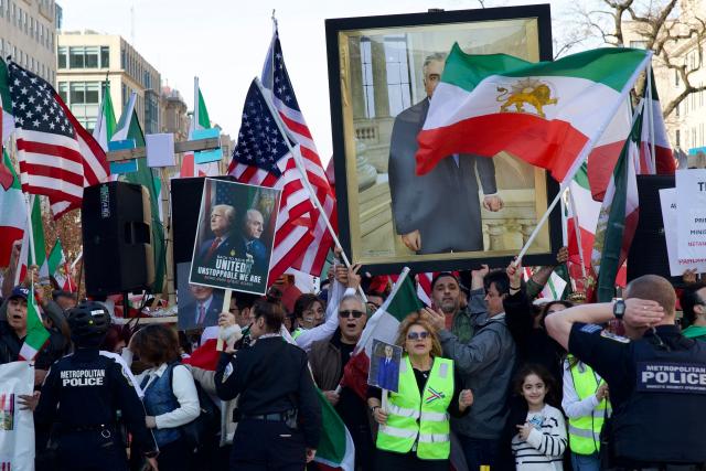 Demonstrators from the Iranian diaspora wave pre-Islamic revolution Iranian and US flags as they protest against the Iranian government in front of the White House in Washington, DC, on March 7, 2026. Protesters gathered in the US capital to denounce the Iranian regime and express solidarity with anti-government movements in Iran. (Photo by Amid FARAHI / AFP)