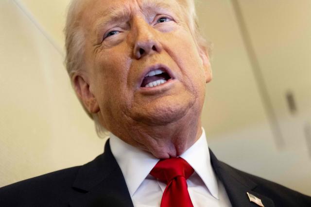 US President Donald Trump speaks with the media aboard Air Force One during a flight from Dover, Delaware, to Miami, Florida, on March 7, 2026. (Photo by SAUL LOEB / AFP)