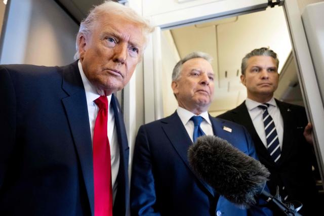 US President Donald Trump speaks with the media as Defense Secretary Pete Hegseth (R) and special envoy Steve Witkoff (C) look on aboard Air Force One during a flight from Dover, Delaware, to Miami, Florida, on March 7, 2026. (Photo by SAUL LOEB / AFP)