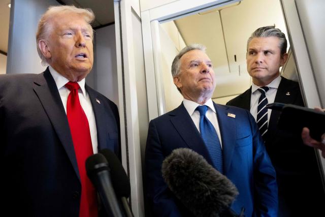 US President Donald Trump speaks with the media as Defense Secretary Pete Hegseth (R) and special envoy Steve Witkoff (C) look on aboard Air Force One during a flight from Dover, Delaware, to Miami, Florida, on March 7, 2026. (Photo by SAUL LOEB / AFP)