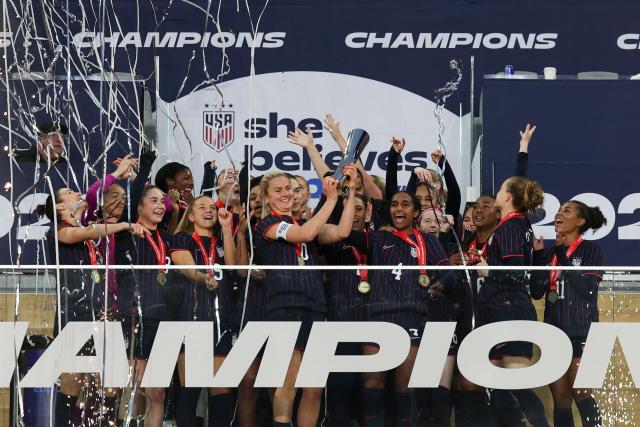 The USWNT hold up the SheBelieves Cup while celebrating after their 1-0 victory against Colombia at Sports Illustrated Stadium on March 7, 2026 in Harrison, New Jersey. (Photo by ANGELA WEISS / AFP)