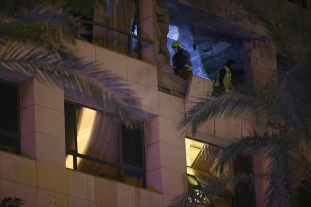 First aid responders inspect a Ramada hotel room targeted by an Israeli strike, in Beirut’s seaside Rawche area, on March 8, 2026. (Photo by Ibrahim AMRO / AFP)