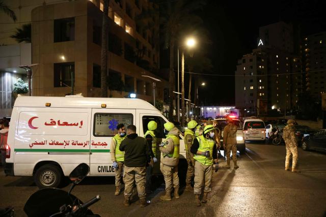 First aid responders gather at a Ramada hotel that was targeted by an Israeli strike, in Beirut’s seaside Rawche area, on March 8, 2026. (Photo by IBRAHIM AMRO / AFP)
