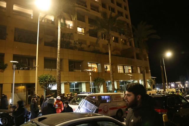 First aid responders gather at a Ramada hotel that was targeted by an Israeli strike, in Beirut’s seaside Rawche area, on March 8, 2026. (Photo by IBRAHIM AMRO / AFP)