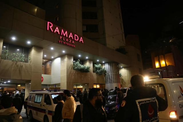 First aid responders gather at a Ramada hotel that was targeted by an Israeli strike, in Beirut’s seaside Rawche area, on March 8, 2026. (Photo by IBRAHIM AMRO / AFP)