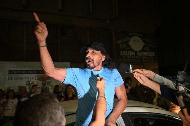 A Venezuelan prisoner gestures after being released from the Bolivarian National Police (PNB) Zone 7 prison in Caracas on March 7, 2026. (Photo by Juan BARRETO / AFP)