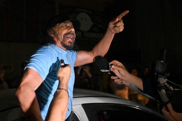 Venezuelan deputy Fernando Orozco gestures after being released from the Bolivarian National Police (PNB) Zone 7 prison in Caracas on March 7, 2026. (Photo by Juan BARRETO / AFP)