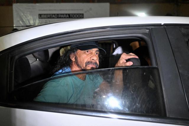 Venezuelan deputy Fernando Orozco looks though a car window after being released from the Bolivarian National Police (PNB) Zone 7 prison in Caracas on March 7, 2026. (Photo by Juan BARRETO / AFP)