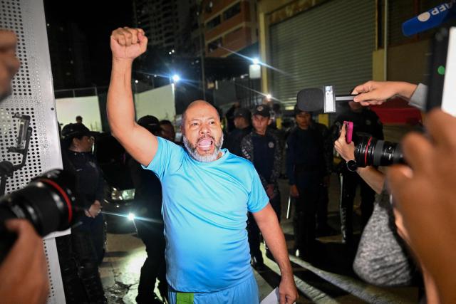Venezuelan prisoner Gilberto Alcala raises his fist after being released from the Bolivarian National Police (PNB) Zone 7 prison in Caracas on March 7, 2026. (Photo by Juan BARRETO / AFP)