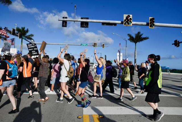 Anti-Trump protesters march towards Mar-a-Lago while clashing with supporters of Donald Trump during a demonstration in Palm Beach, Florida, on March 7, 2026. (Photo by Octavio JONES / AFP)