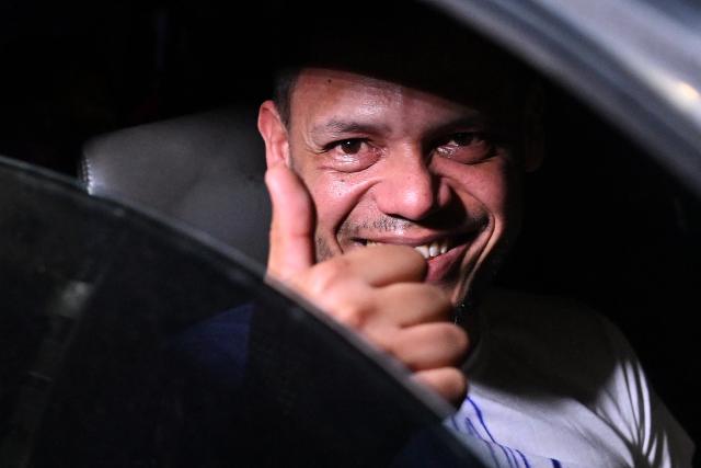 Venezuelan prisoner Victor Borges gives a thumbs up after being released from the Bolivarian National Police (PNB) Zone 7 prison in Caracas on March 7, 2026. (Photo by Juan BARRETO / AFP)