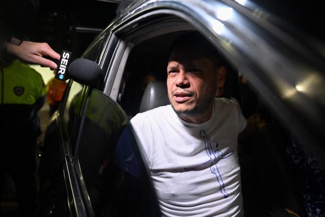Venezuelan prisoner Victor Borges gestures after being released from the Bolivarian National Police (PNB) Zone 7 prison in Caracas on March 7, 2026. (Photo by Juan BARRETO / AFP)