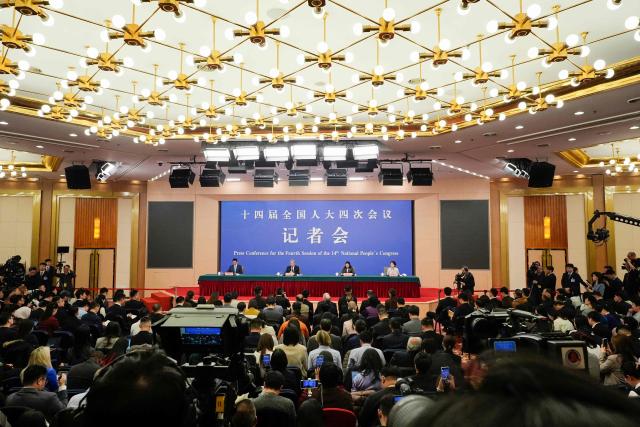 China's Foreign Minister Wang Yi (2nd L), who is also a member of the Political Bureau of the Communist Party of China Central Committee, attends a press conference on the country's foreign policy and external relations for the fourth session of the 14th National People's Congress (NPC) in Beijing on March 8, 2026. (Photo by Iori Sagisawa / POOL / AFP)