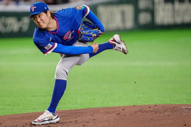 Taiwan’s Gu Lin Ruei-yang pitches during the World Baseball Classic (WBC) Pool C game between Taiwan and South Korea at the Tokyo Dome in Tokyo on March 8, 2026. (Photo by Yuichi YAMAZAKI / AFP)