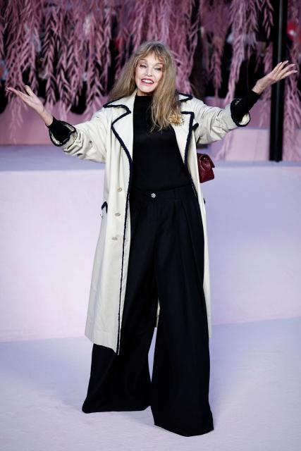 (FILES) French actress and singer Arielle Dombasle poses upon arrival for the Chanel Women's Haute Couture Spring/Summer 2026 collection fashion show as part of the Paris Haute Couture Fashion Week, in Paris, on January 27, 2026. Grey-haired models, "sexygenarians" in the front rows of shows and "mature" buyers courted by designers to boost their sales: women over 50 are gradually gaining visibility in fashion. (Photo by Sebastien DUPUY / AFP)