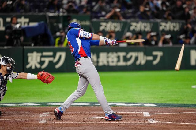 Taiwan’s Chen Chen-wei hits a single during the World Baseball Classic (WBC) Pool C game between Taiwan and South Korea at the Tokyo Dome in Tokyo on March 8, 2026. (Photo by Yuichi YAMAZAKI / AFP)