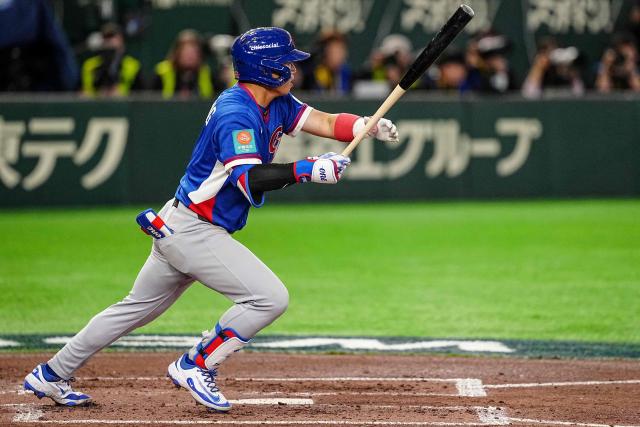 Taiwan’s Cheng Tsung-che hits a single during the World Baseball Classic (WBC) Pool C game between Taiwan and South Korea at the Tokyo Dome in Tokyo on March 8, 2026. (Photo by Yuichi YAMAZAKI / AFP)