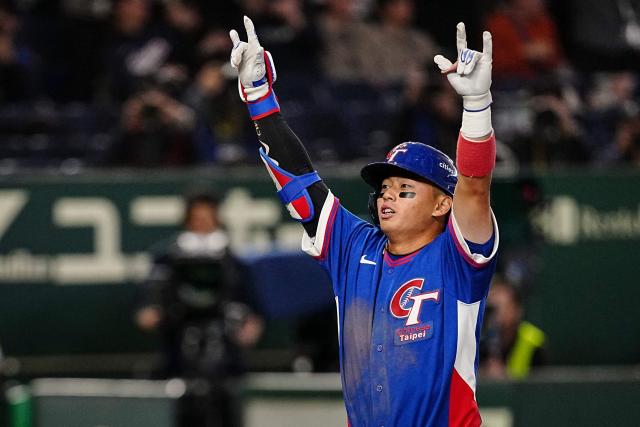 Taiwan’s Tsung-Che Cheng celebrates as he hits a home run during the World Baseball Classic (WBC) Pool C game between Taiwan and South Korea at the Tokyo Dome in Tokyo on March 8, 2026. (Photo by Yuichi YAMAZAKI / AFP)