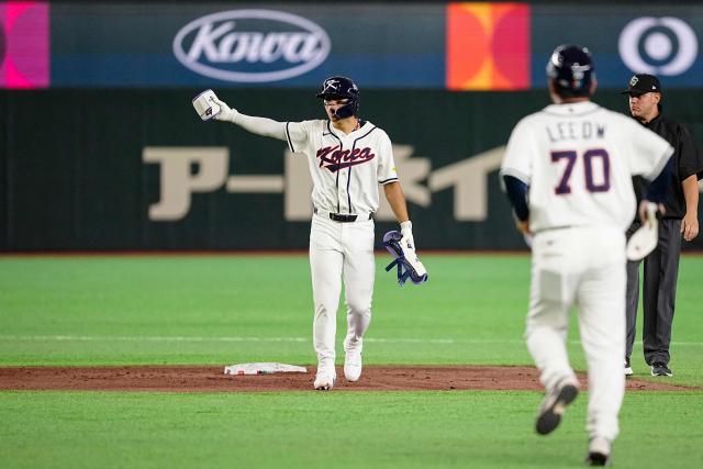 South Korea's Kim Do-yeong reacts as he hits a double during the World Baseball Classic (WBC) Pool C game between Taiwan and South Korea at the Tokyo Dome in Tokyo on March 8, 2026. (Photo by Yuichi YAMAZAKI / AFP)
