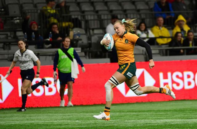 Australia’s Maddison Levi scores a try against USA during the HSBC Canada Rugby Sevens tournament in Vancouver, Canada, on March 7, 2026. (Photo by Don MacKinnon / AFP)
