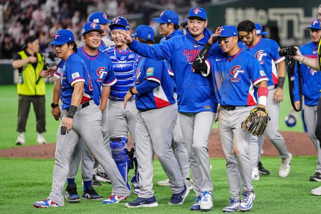 Taiwan players celebrate their victory after the World Baseball Classic (WBC) Pool C game between Taiwan and South Korea at the Tokyo Dome in Tokyo on March 8, 2026. (Photo by Yuichi YAMAZAKI / AFP)