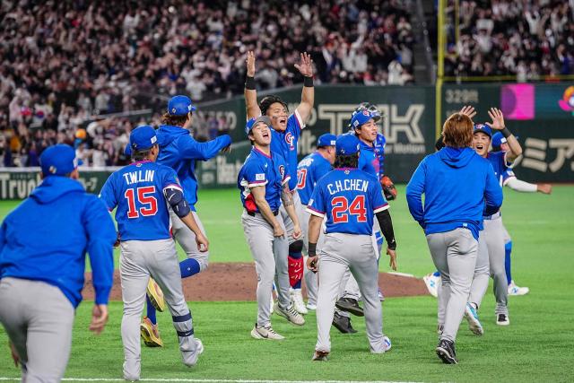 Taiwan players celebrate their victory after the World Baseball Classic (WBC) Pool C game between Taiwan and South Korea at the Tokyo Dome in Tokyo on March 8, 2026. (Photo by Yuichi YAMAZAKI / AFP)