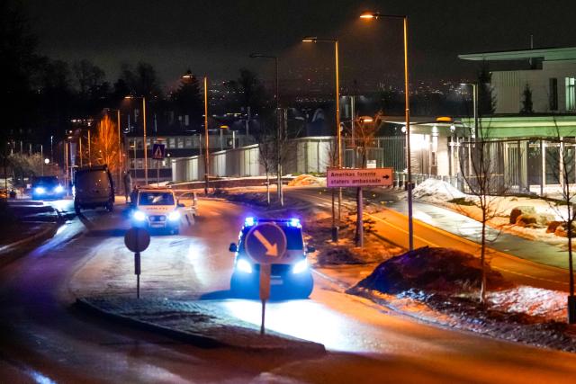 Police vehicles park outside the US embassy after a loud bang was reported during the night but no injuries were reported in Oslo on March 8, 2026. (Photo by Javad Parsa / NTB / AFP) / Norway OUT