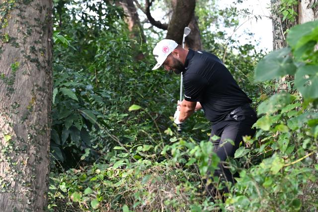 LIV Golf team Legion XIII GC captain Jon Rahm of Spain hits a ball out of the rough on the 18th fairway on day four of the LIV Golf tournament at Fanling golf club in Hong Kong on March 8, 2026. (Photo by Peter PARKS / AFP)