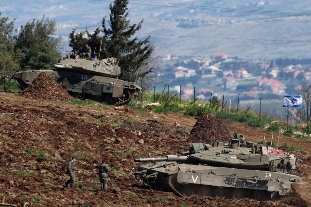 Israeli tanks gather at a position along the Israel-Lebanon border on March 8, 2026. Lebanon was drawn into the Middle East war on March 2, when Iran-backed militant group Hezbollah attacked Israel in response to the killing of Iranian supreme leader Ayatollah Ali Khamenei during US-Israeli strikes. Israel, which has kept up strikes targeting Hezbollah despite a 2024 ceasefire, launched multiple waves of strikes this week across Lebanon and sent ground troops into border areas. (Photo by Jack GUEZ / AFP)