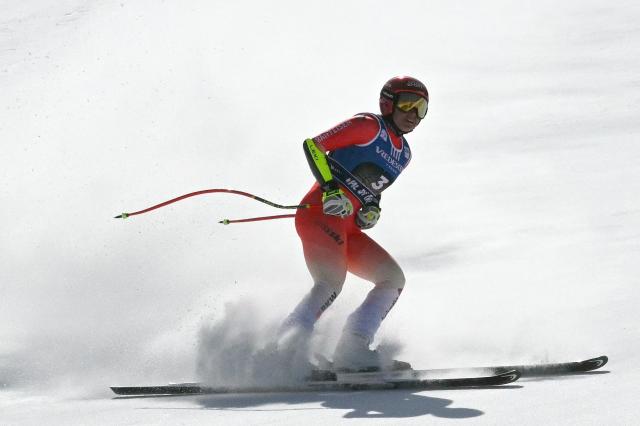 Switzerland's Corinne Suter competes in the Women's Super G race of the FIS Ski World Cup at the La Volata slope in the Passo San Pellegrino ski area, Val di Fassa, Italy on March 8, 2026. (Photo by Andreas SOLARO / AFP)