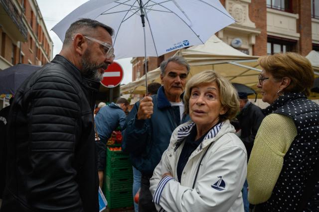 (FILES) Mayor of Montauban Brigitte Bareges speaks to shoppers at a market in Montauban on June 22, 2024. Although Brigitte Barèges is not appearing on the ballot for the municipal elections in Montauban for the first time since 2001. The former mayor, formerly of the LR and now of the UDR, left her post in 2024 to return to parliament in the early general elections. However, she was declared ineligible a year later by the Constitutional Council due to irregularities in her campaign accounts. The woman who long reigned over public life in Montauban, was on France 3 on March 4, 2026 with five of the seven candidates who came to debate before the first round, to support the man she has chosen as her heir: her former director general of services, Didier Lallemand. (Photo by Ed JONES / AFP)
