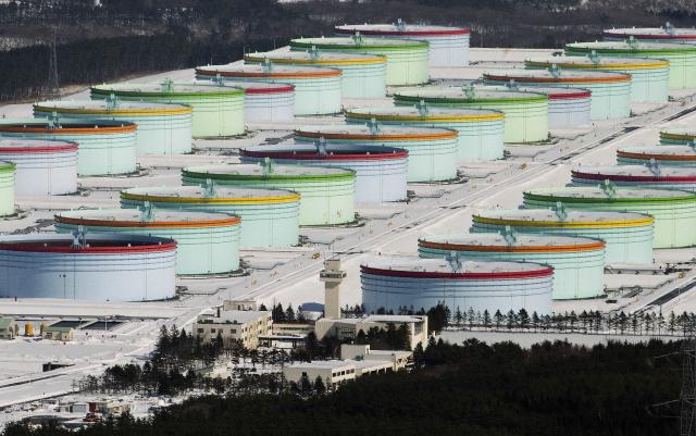 This photo taken on February 11, 2016 shows the Mutsu Ogawara National Oil Stockpiling Base, the first national oil stockpiling base designed to ensure a stable supply of oil in emergencies, in Rokkasho Village, Aomori Prefecture. The price of the main US benchmark for oil surged more than 30 percent on March 9, 2026 over concerns that the Middle East war could create prolonged supply disruptions. (Photo by JIJI PRESS / AFP) / Japan OUT