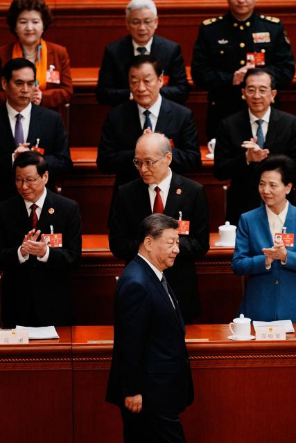 Chinese President Xi Jinping arrives for a plenary session of China's National People's Congress (NPC) at the Great Hall of the People in Beijing on March 9, 2026. (Photo by Vincent Thian / POOL / AFP)