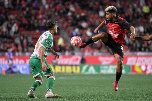 Tijuana's Venezuelan forward #30 Josef Martinez (R) controls the ball past Santos' midfielder #06 Javier Guemez (L) during the Liga MX Clausura football match between Tijuana and Santos Laguna at Caliente stadium in Tijuana, Mexico on March 8, 2026. (Photo by Guillermo ARIAS / AFP)